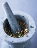A barbecue herb and spice mixture in a mortar