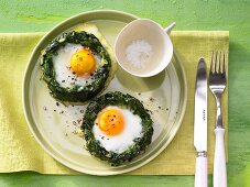 Spinach nests with eggs