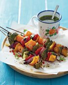 Grilled vegetable kebabs with herb oil