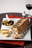 Pork & chicken terrine with prunes and balsamic onions
