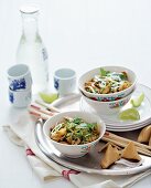Chinese egg noodles with chicken and coriander leaves