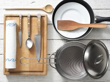 Kitchen utensils for preparing spinach and apricots with fish