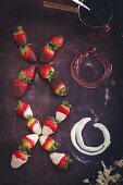 An XOXO greeting made of strawberries dipped in chocolate and melted chocolate
