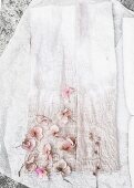 Subtly dyed fabric and pale pink hydrangea flowers