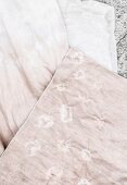 Hand-dyed pink fabric with delicate pattern