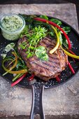 Steak with herb butter and colourful chard