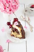 A slice of Donauwelle (German marble cake) Bundt cake with a cheesecake filling