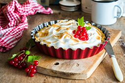 A pie with redcurrant filling topped with toasted meringue