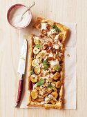 Caramelised banana tart with yoghurt and flaked almonds