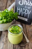 Watercress soup in a glass jar