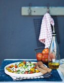 A South African salad with samp, tomatoes, red onion and herbs