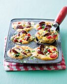 Chorizo, tomato and feta tarts in a cake tin