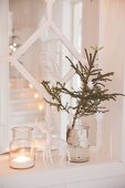 Christmas decorations arranged in front of lattice window