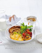 A superfood brunch: pepper filled with cocktail tomatoes and served with scrambled egg and toasted bread