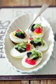 Eggs with a duo of caviar and cucumber