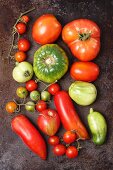 Assorted types of organic tomatoes (seen from above)