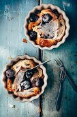 Bread pudding made of croissants with cherries and icing sugar