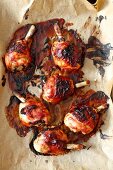 Baked BBQ chicken legs on baking paper