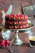 Rich moist chocolate cake with whipped chocolate ganache and raspberries, open layers