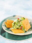 Spicy macadamia cheese crackers with courgette salad