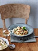 Chicken fricassée with mushrooms on a rustic wooden table