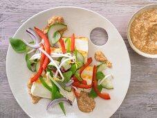 Asian tofu salad with cucumber, peppers and sweet and sour cashew pesto
