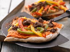 Potato pizza with minced meat and peppers