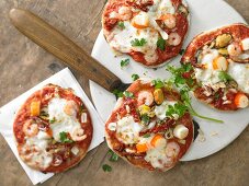 Seafood pizzas with fennel and orange