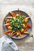 Glazed sweet potato wedges with lamb's lettuce, chestnuts and toasted pumpkin seeds