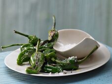 Pan-fried mini green peppers in with olive oil and sea salt