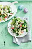 An Easter salad with surimi, quail eggs, radishes and pea mayonnaise