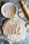 An unbaked spelt flatbread and spelt flour