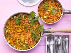 Pan-cooked wheat and vegetable dish with courgette, carrot and yellow pepper