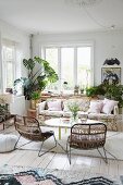 Floral couch and house plants in comfortable lounge
