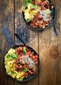 Pappardelle with slow-roasted lamb ragù, blackened vine tomatoes, Parmesan and basil