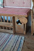 Bench with chicken pen in historical farmhouse