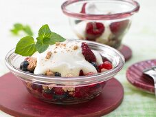 Berry dessert with honey vanilla foam and biscuit crumbs