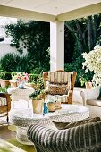 Various wicker furniture on summer veranda