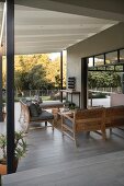 Elegant lounge area on roofed modern veranda