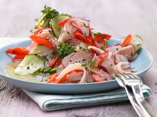 Colorful sausage salad with horseradish