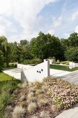 Concrete balustrade wall, terrace and pool in gardens
