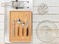 Kitchen utensils for making chicken thighs with potatoes