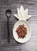 Herbal and fruit tea on a pineapple-shaped serving dish