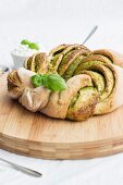 A pesto bread ring with basil