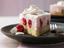 A raspberry cream cake with a biscuit base