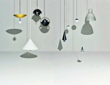 Various designer pendant lamps casting shadows