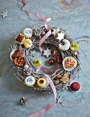 A festive wreath decorated with various Christmas biscuits
