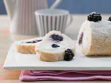 A blackberry sponge roll filled with yoghurt and buttermilk cream