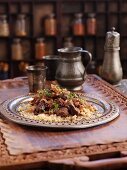 Beef tagine on a bed of couscous (North Africa)