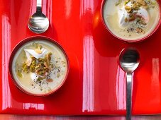 Cream of artichoke soup with olives and almonds
